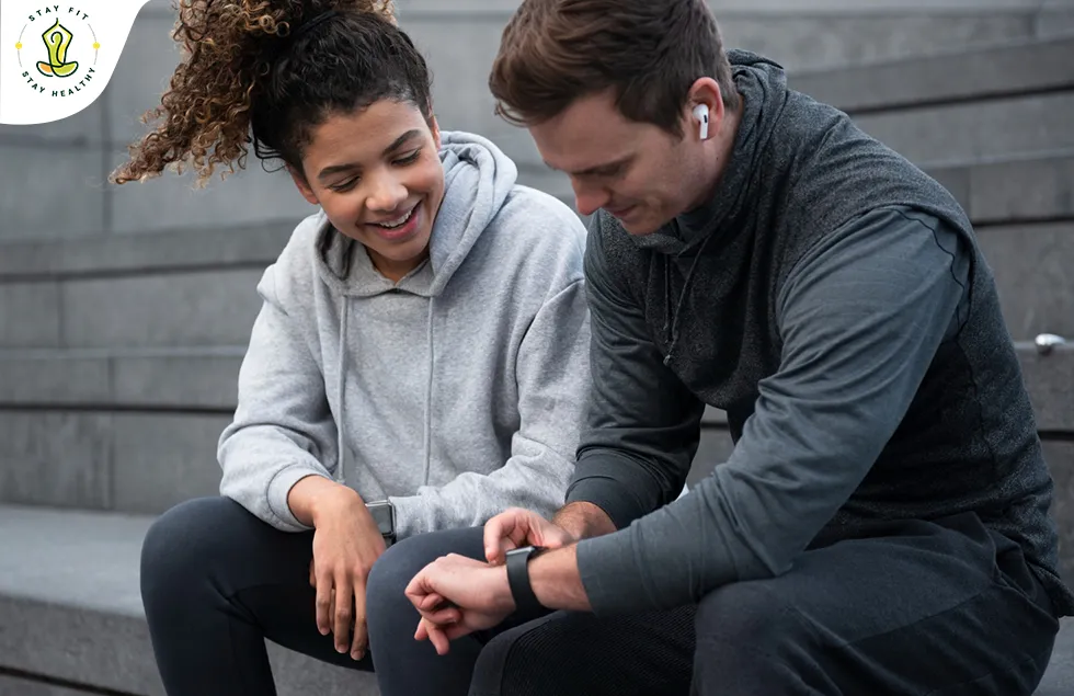  A couple checking their fitness reading in their watch