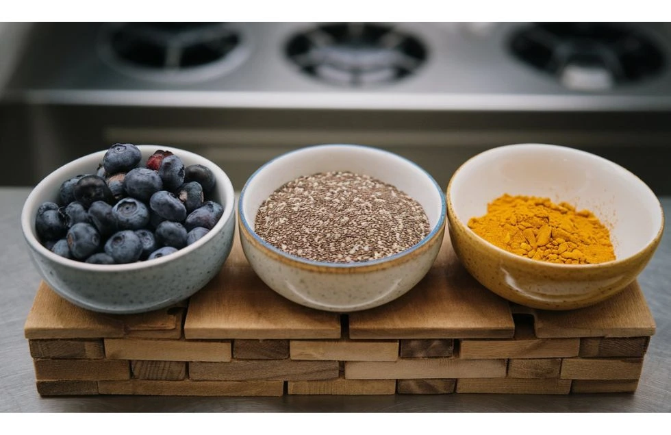  3 bowls containing blueberry, chia seeds and turmeric